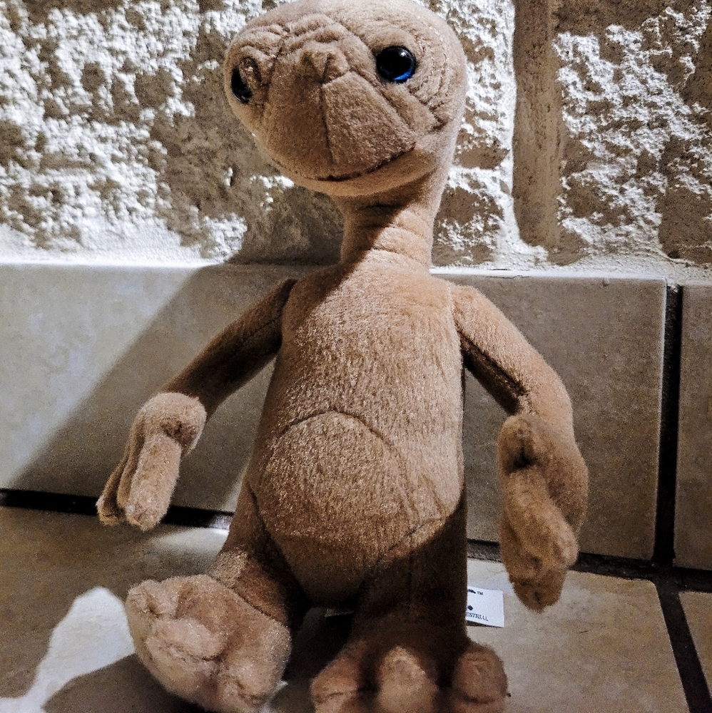 E.T. plush doll. New. Stands about 8 inches.